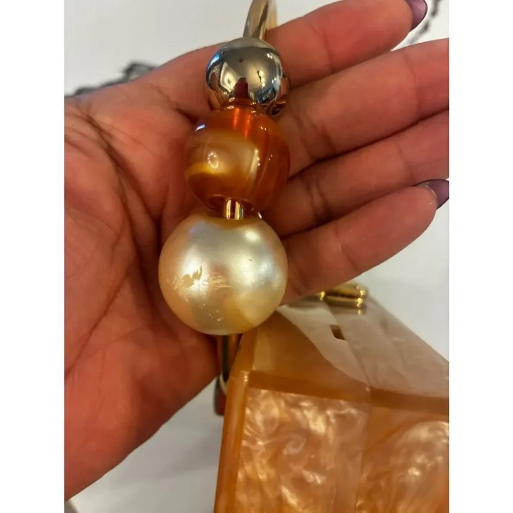 Lulu's Pearlescent Pink Acrylic Box Clutch with Gold Ring Handle